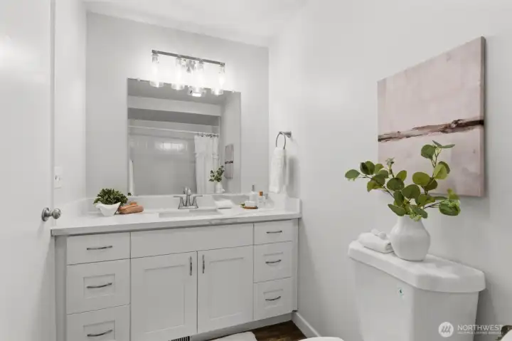 Updated bathrooms offer style and convenience.