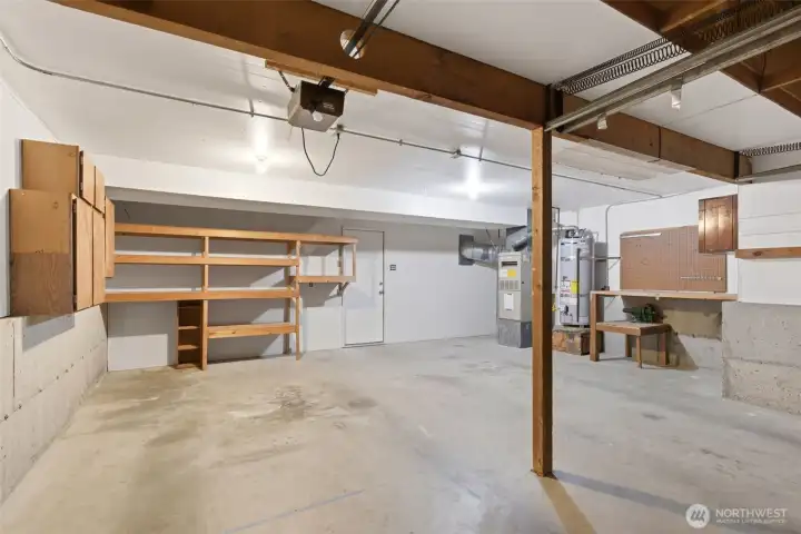 The working table provides extra space for your hobbies in this ample garage.