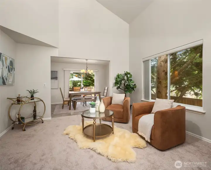 Living area flowing seamlessly into dining area and kitchen.
