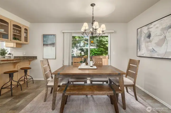 Dining area with access to patio via sliding glass doors.