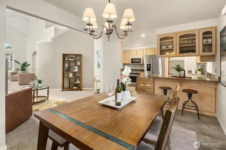 Dining area leading to kitchen.