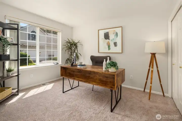 Main floor bedroom with flexible use for den/office.