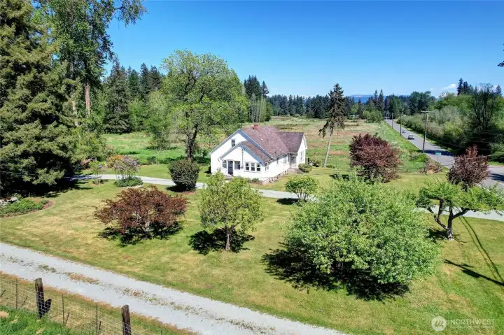 View of the farmhouse from west side of the property