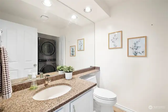 Convenient half bath with combined laundry is a great use of space.