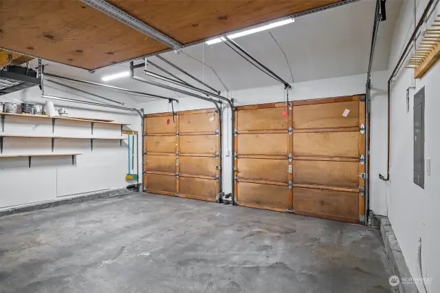 Two car attached garage has plenty of room for extra storage.