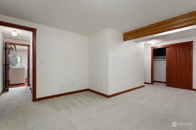 Carpeted family room in basement.