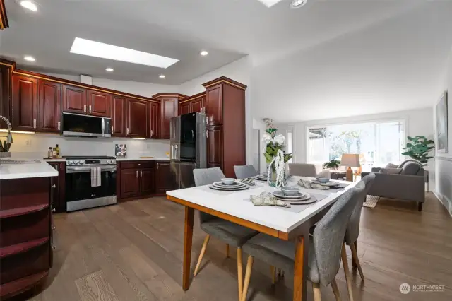 A large skylight and abundance of canned lighting, create the perfect atmosphere for cooking in this wonderful kitchen
