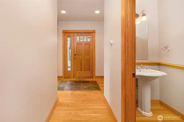 Entry and a view of the powder room.