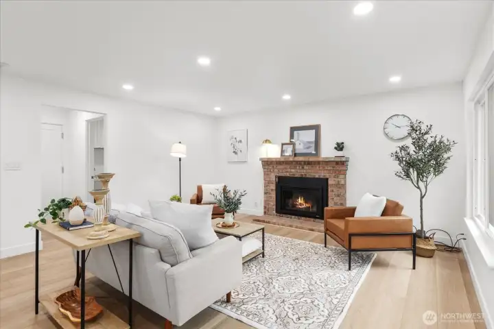 A new gas fireplace anchors the 2nd of the two living areas.