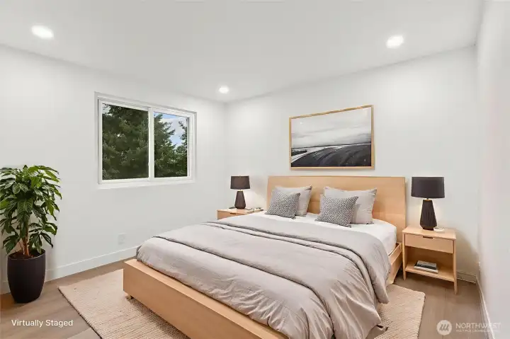 Bedroom 4. Luxury vinyl plank flooring, fresh paint, solid wood, single-panel white shaker doors with full wood craftsman bungalow casing craftsman trim, and adjustable canless lighting throughout the home.