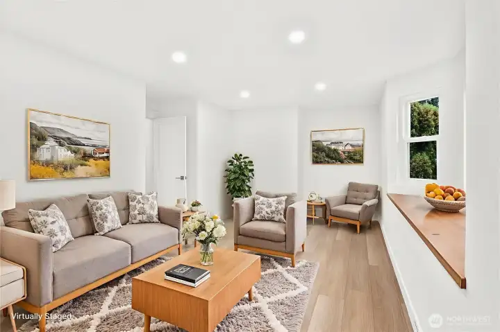 Den, featuring bay window with window bench storage. Luxury vinyl plank flooring, fresh paint, solid wood, single-panel white shaker doors with full wood craftsman bungalow casing craftsman trim, and adjustable canless lighting throughout the home.