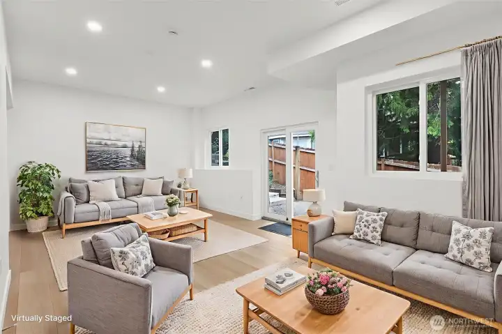 Fully renovated finished basement. Walk out the glass sliding door to a backyard patio. Rockwool insulation on the ceiling for noise reduction. Plumbed for a wet bar. Luxury vinyl plank flooring, fresh paint, solid wood, single-panel white shaker doors with full wood craftsman bungalow casing craftsman trim, and adjustable canless lighting throughout the home.
