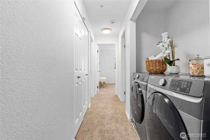 Utility closet with your full-sized Washer/Dryer set that stays.