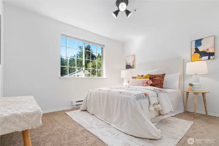 The guest bedroom is also generously sized and receives warm afternoon sunlight with western views.