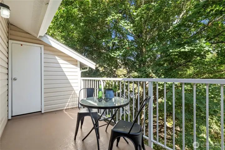 Enjoy your morning cup of coffee or al fresco dining out on the balcony with a peaceful backdrop. Additional storage unit on balcony.