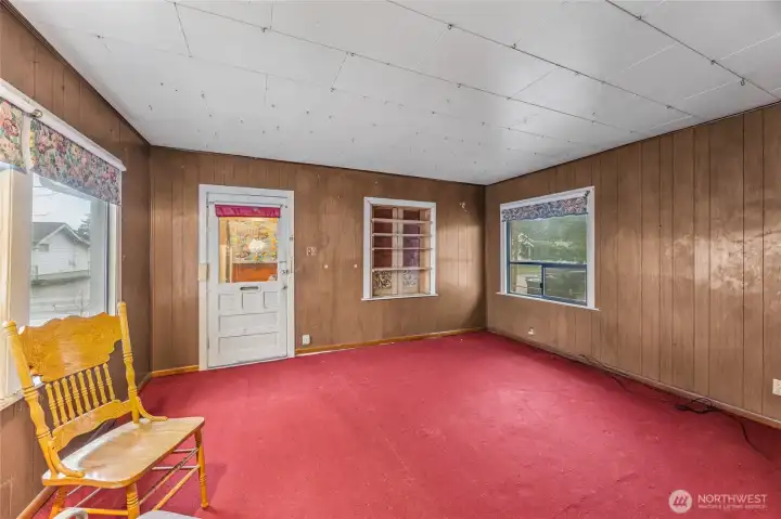 Step through the front vestibule into a well-proportioned living room with great potential.