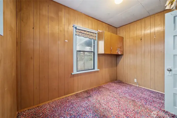 One of two designated bedrooms on the main level.