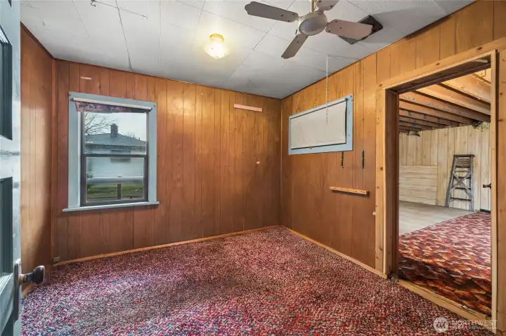 One of two lower bedrooms opens into the the expanded back portion of home.