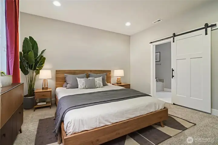 Main-level primary suite with spacious layout - Virtually staged