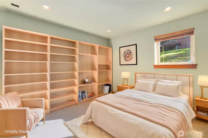 Lower bedroom with built-in shelving