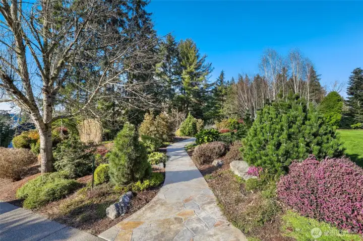 Stamped concrete path leading to another private seating area