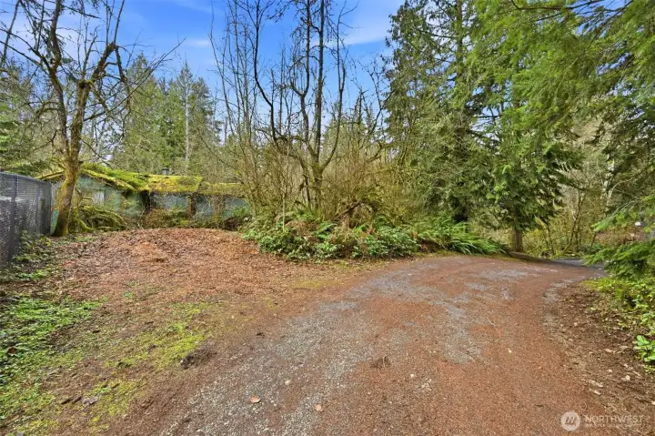 This road and property end at the fence on the North of the property