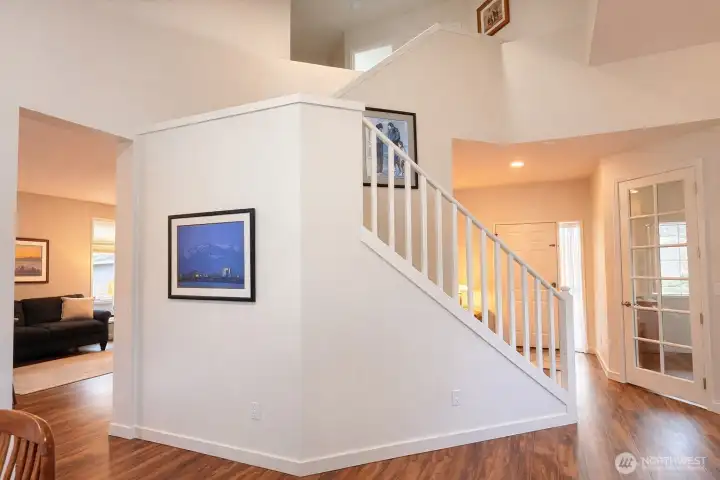 Impressive stairway to the bedrooms, notice the vaulted ceilings.