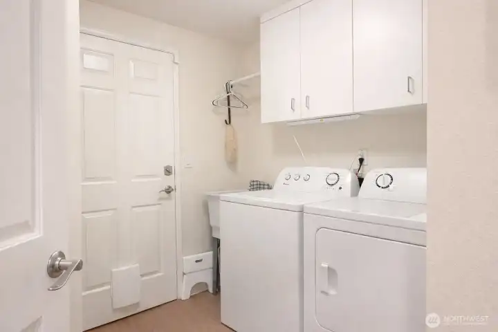 A convenient place for the washer and dryer, the door to the left leads into the 2 1/2 car garage.