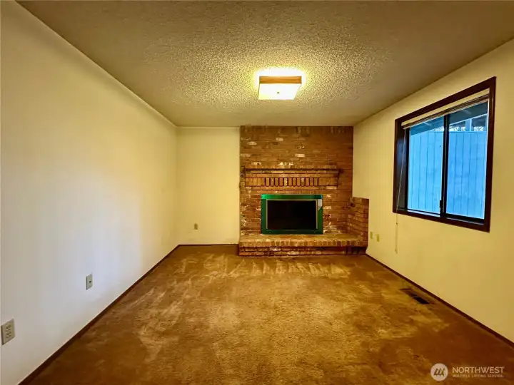 Den/Office space with wood-burning fireplace