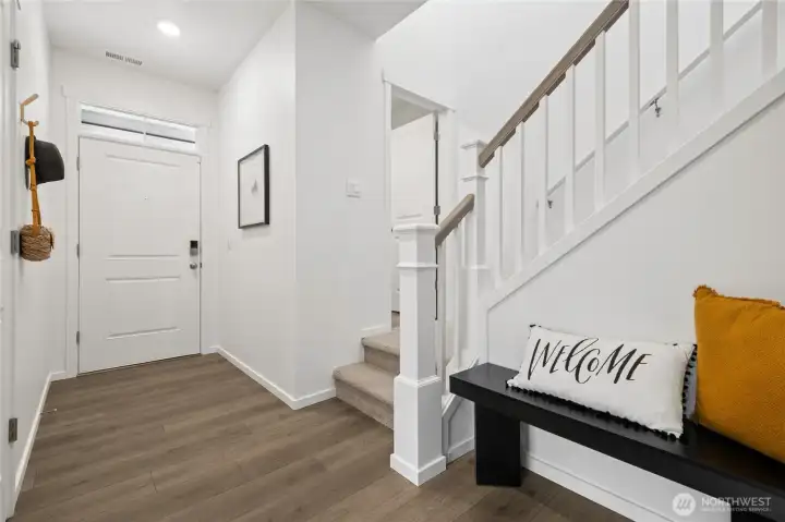 Entry way, with the drop zone area below the stairs. Photos are for representational purposes only, colors, elevation and features may vary.