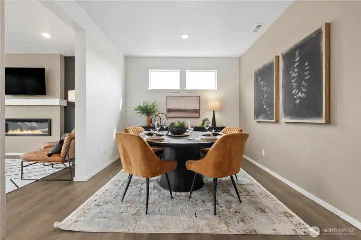 Formal dining separated by living area. Photos are for representational purposes only, colors, elevation and features may vary.