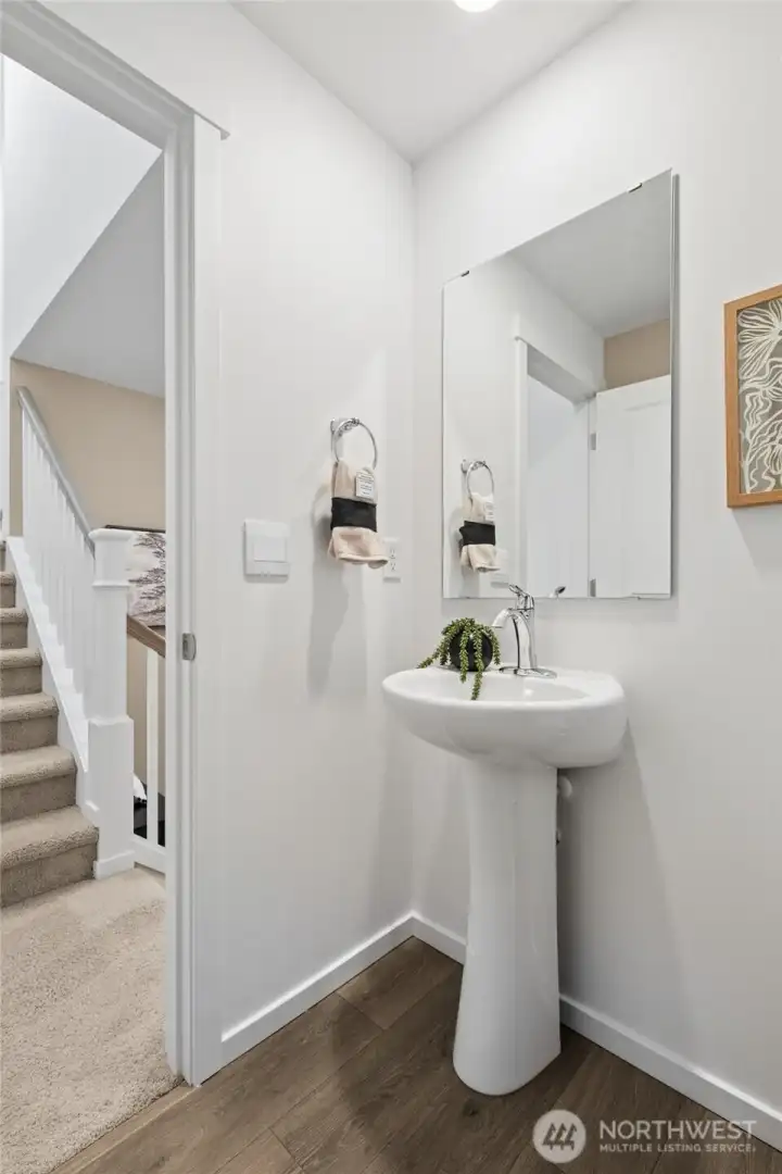 Downstairs half bathroom. Photos are for representational purposes only, colors, elevation and features may vary.