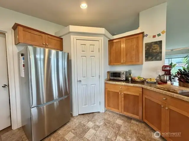 Besides a brand new fridge, you've got a walk in pantry as well.