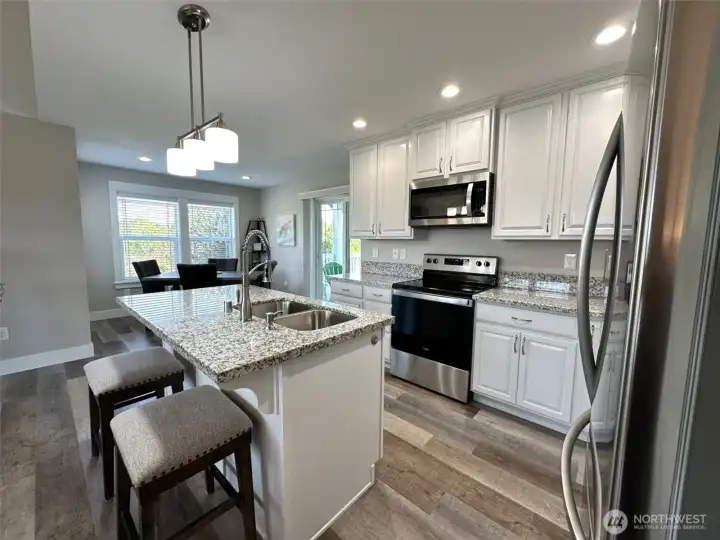 Kitchen with granite countertops and SS appliances