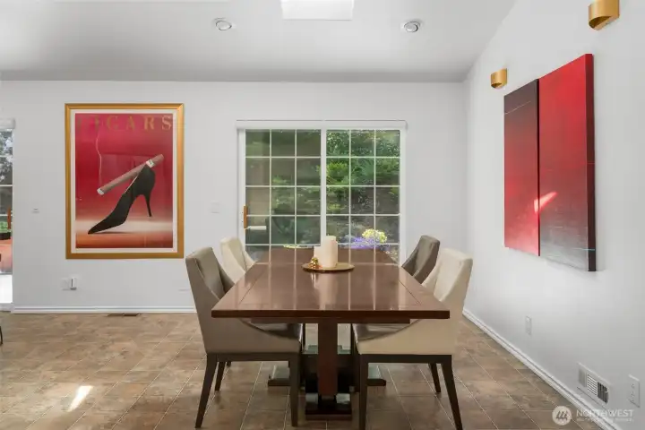 Dining room with sliding glass door to large deck.