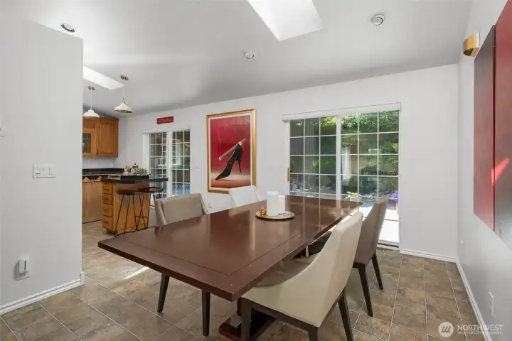 Dining room and kitchen have sliding glass doors to large deck.