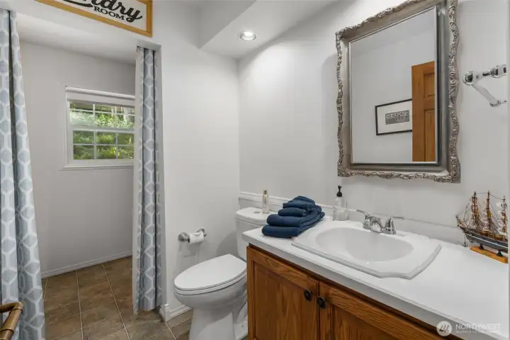 Hall 1/2 bathroom with laundry.