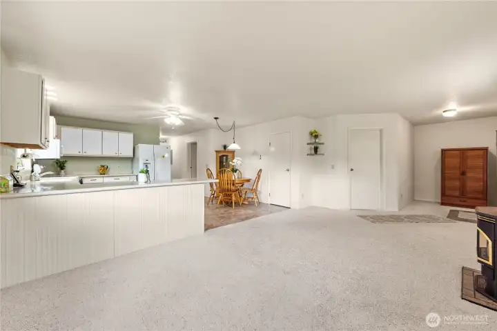 Large bedroom behind that first door to the left of the armour, door next to dining table is the pantry.