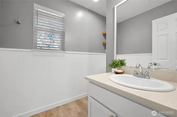Sweet half bath on the main level just inside the front door for guests. Sweet half bath on the main level just inside the front door for guests.