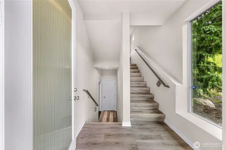Welcome in! Upstairs to the home, down to the garage and extra under-stair storage Welcome in! Upstairs to the home, down to the garage and extra under-stair storage