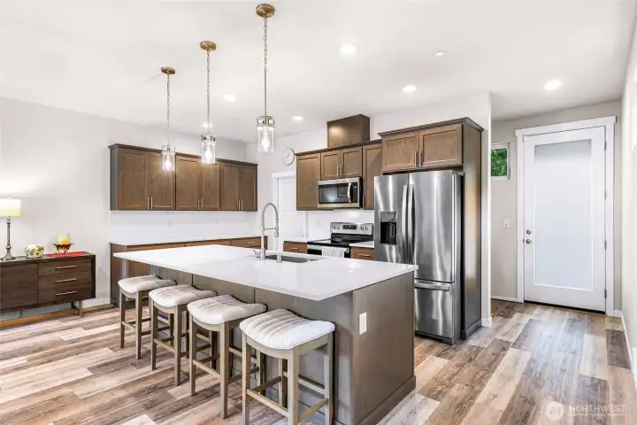 Room for both a dining table and bar seating! Room for both a dining table and bar seating!