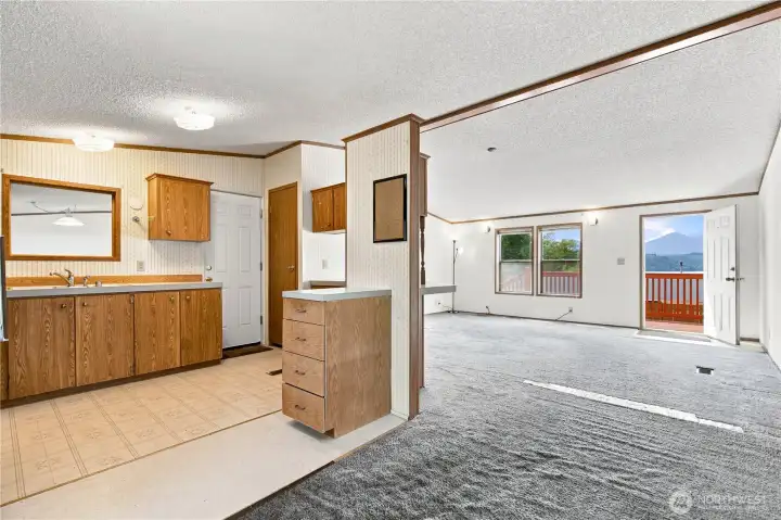 Kitchen with attached garage entrance. Open concept to dining and living rooms Kitchen with attached garage entrance. Open concept to dining and living rooms