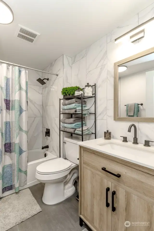 Well-dressed full bath serves your guests and bedrooms two and three.