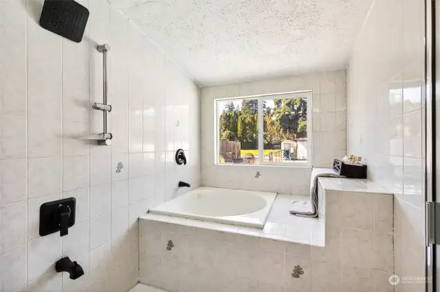 Fully Tiled Room w/Large Soaking Tub & Shower. Easy clean ups after pool time fun!