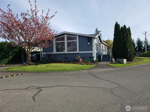 Picture of the Front of the Home on a Corner Lot Looking toward the Mountains.