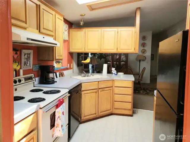 Picture of the very Workable Kitchen Looking into the Extra Living Room.