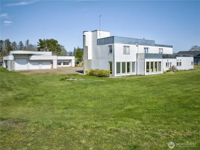 3,600 sq ft custom house & garage, 4 bedrooms, 2.5 bath with 4100 sq ft detached  6 car garage with wood shop and storeroom.