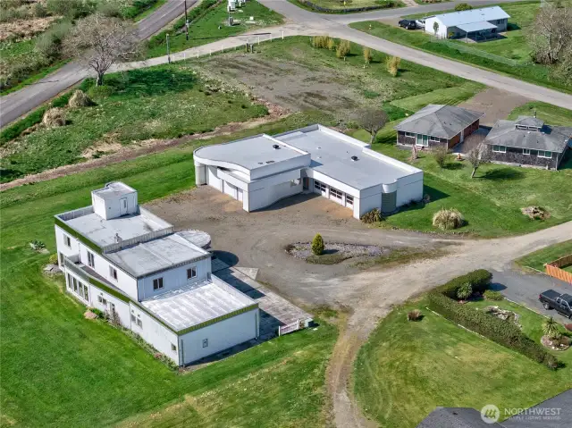 3,600 sq ft custom house & garage, 4 bedrooms, 2.5 bath with 4100 sq ft detached  6 car garage with wood shop and storeroom.