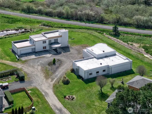 3,600 sq ft custom house & garage, 4 bedrooms, 2.5 bath with 4100 sq ft detached  6 car garage with wood shop and storeroom.