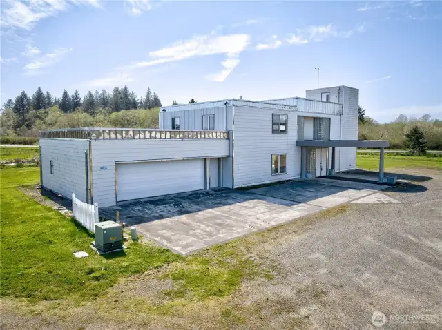 3,600 sq ft custom house & garage, 4 bedrooms, 2.5 bath with 4100 sq ft detached  6 car garage with wood shop and storeroom.
